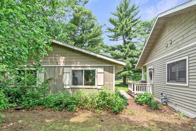 8619 Dove St, Breezy Point, MN 56472 - view of side of home featuring a wooden deck