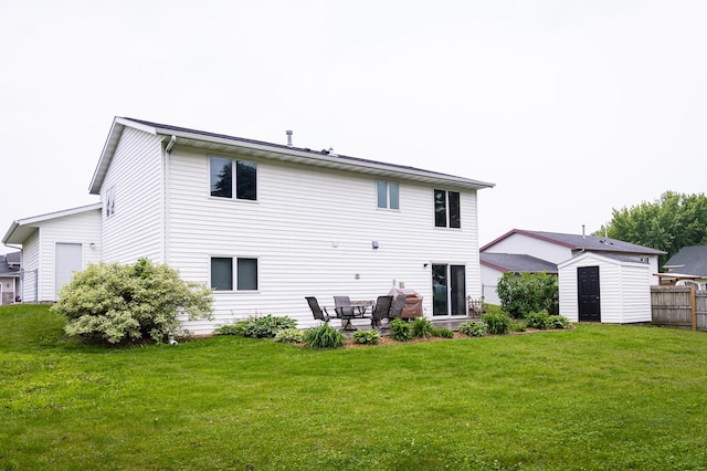415 3rd St NW, Elgin, MN 55932 - back of house with a storage shed, a patio, and a yard