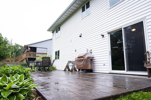 415 3rd St NW, Elgin, MN 55932 - wooden terrace with outdoor dining space and stairs