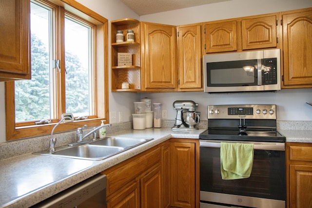 415 3rd St NW, Elgin, MN 55932 - kitchen featuring stainless steel appliances, healthy amount of natural light, and light countertops