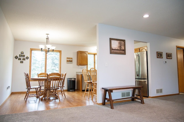 415 3rd St NW, Elgin, MN 55932 - dining room featuring a chandelier and light wood finished floors