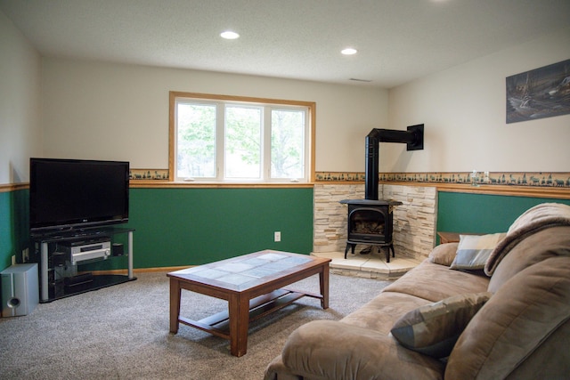 415 3rd St NW, Elgin, MN 55932 - living area with carpet floors, a wood stove, and recessed lighting