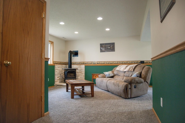 415 3rd St NW, Elgin, MN 55932 - living area with carpet floors, recessed lighting, and a wood stove