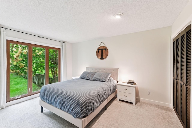 6641 Halstead Ave, Mound, MN 55364 - bedroom with multiple windows, light colored carpet, a textured ceiling, and a closet