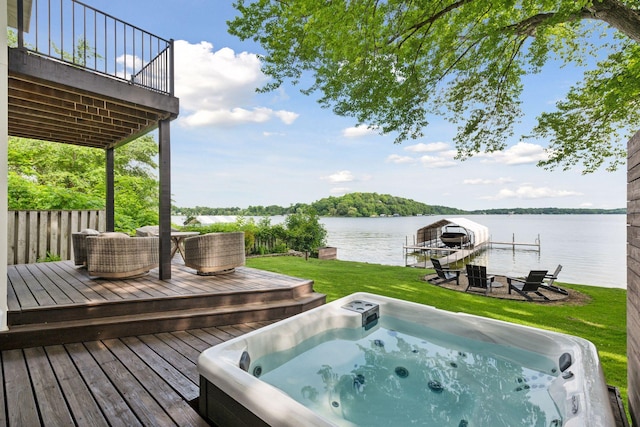 6641 Halstead Ave, Mound, MN 55364 - deck featuring a hot tub, boat lift, a water view, a yard, and a boat dock