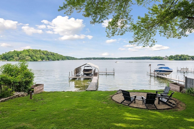 6641 Halstead Ave, Mound, MN 55364 - dock with boat lift, a lawn, a water view, and an outdoor fire pit