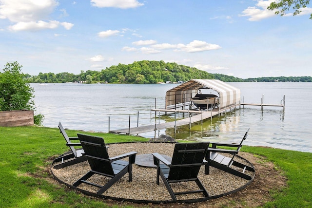 6641 Halstead Ave, Mound, MN 55364 - dock area featuring boat lift, a water view, and a lawn
