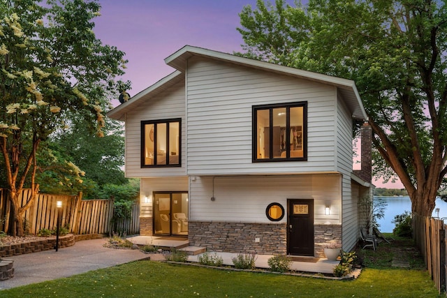 6641 Halstead Ave, Mound, MN 55364 - contemporary home featuring stone siding and a water view