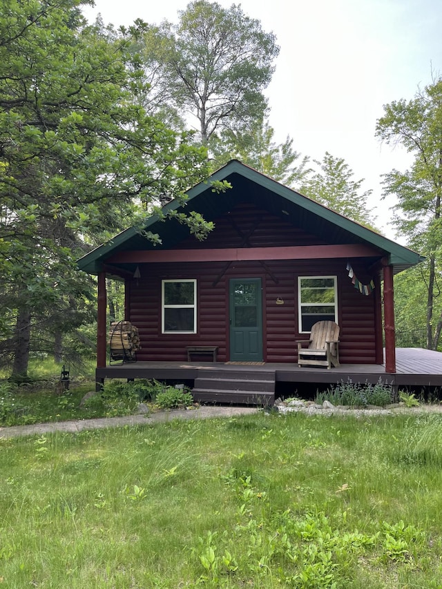 38010 Clover Cir, Hinckley, MN 55037 - log home featuring covered porch and log veneer siding