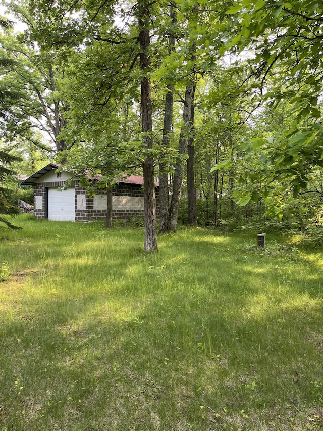 38010 Clover Cir, Hinckley, MN 55037 - view of yard featuring an outdoor structure and a detached garage