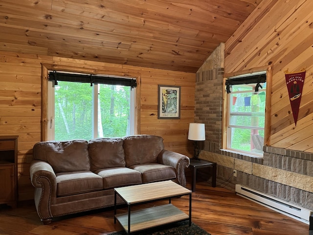 38010 Clover Cir, Hinckley, MN 55037 - living room featuring a baseboard heating unit, lofted ceiling, wood walls, healthy amount of natural light, and wood-type flooring