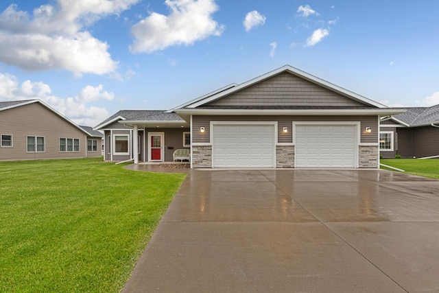 755 Escalade Ln SE, Owatonna, MN 55060 - view of front facade featuring concrete driveway, an attached garage, a front yard, and stone siding