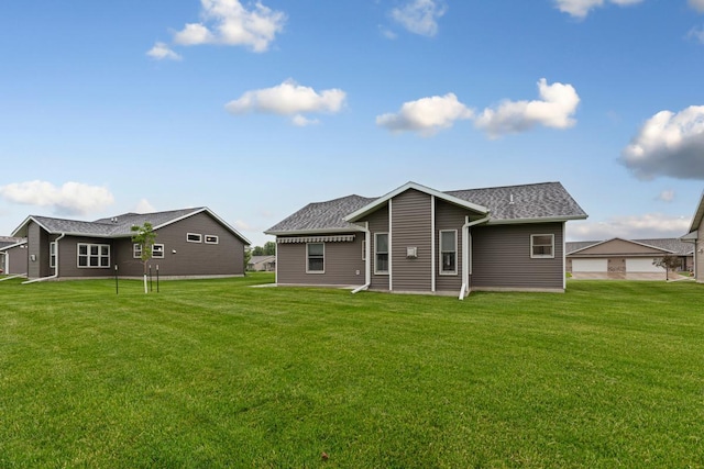 755 Escalade Ln SE, Owatonna, MN 55060 - rear view of house featuring a yard and roof with shingles