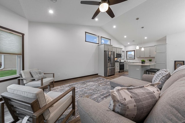755 Escalade Ln SE, Owatonna, MN 55060 - living room featuring ceiling fan, wood finished floors, high vaulted ceiling, and recessed lighting