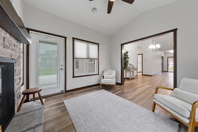 755 Escalade Ln SE, Owatonna, MN 55060 - sitting room with vaulted ceiling, plenty of natural light, ceiling fan, light wood-style floors, and a fireplace
