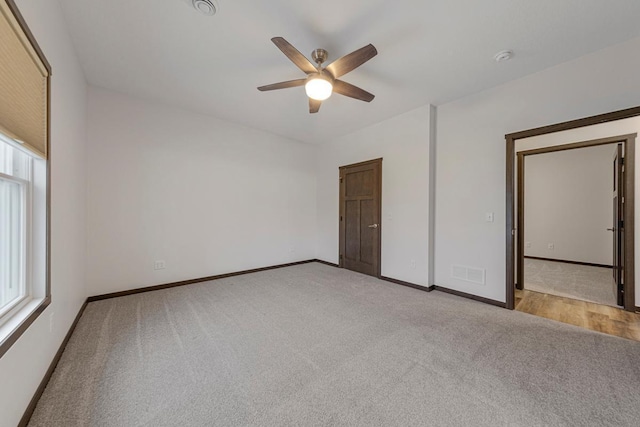 755 Escalade Ln SE, Owatonna, MN 55060 - unfurnished bedroom featuring carpet flooring and ceiling fan