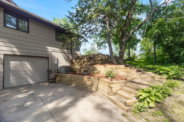 17208 Woodbine St NW, Andover, MN 55304 - view of side of home featuring an attached garage and driveway