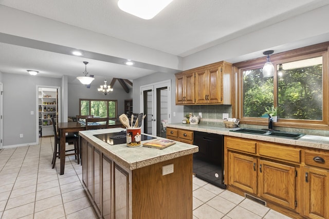 17208 Woodbine St NW, Andover, MN 55304 - kitchen featuring black appliances, light tile patterned floors, tasteful backsplash, a center island, and brown cabinetry