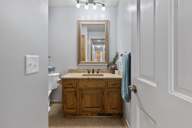 17208 Woodbine St NW, Andover, MN 55304 - bathroom with vanity and toilet