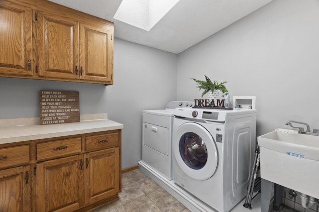 17208 Woodbine St NW, Andover, MN 55304 - laundry area featuring a skylight, separate washer and dryer, and cabinet space