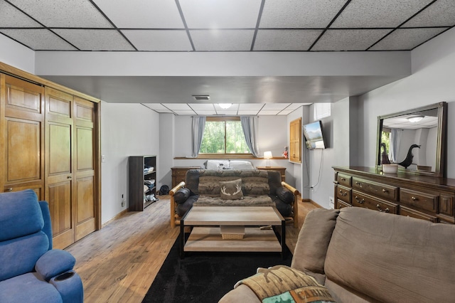 17208 Woodbine St NW, Andover, MN 55304 - living area featuring light wood-style flooring and a drop ceiling
