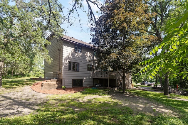 17208 Woodbine St NW, Andover, MN 55304 - back of house featuring stairs and a wooden deck