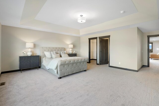 13566 Birdsong Path, Rosemount, MN 55068 - bedroom featuring a tray ceiling and light carpet