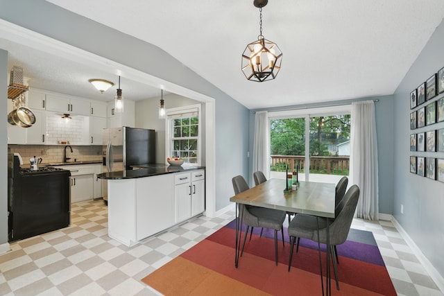 3826 Adair Ave N, Crystal, MN 55422 - dining area featuring light flooring and lofted ceiling