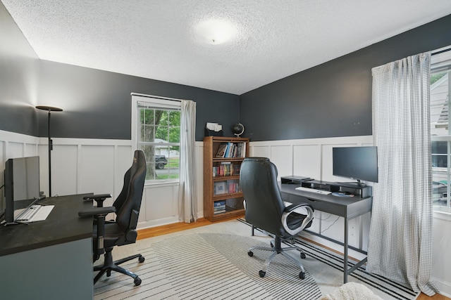 3826 Adair Ave N, Crystal, MN 55422 - office with a textured ceiling, a decorative wall, a wainscoted wall, and wood finished floors