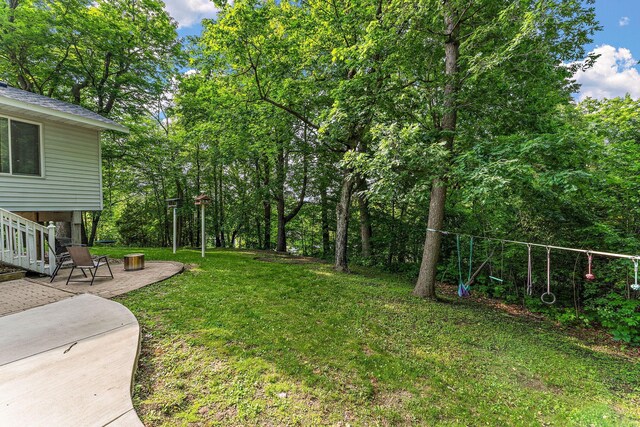 1202 Matteson St, Faribault, MN 55021 - view of green lawn with a patio area