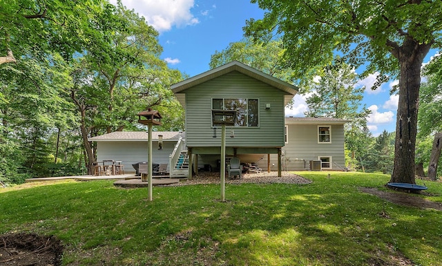 1202 Matteson St, Faribault, MN 55021 - rear view of house with a yard