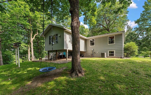 1202 Matteson St, Faribault, MN 55021 - rear view of property featuring a lawn