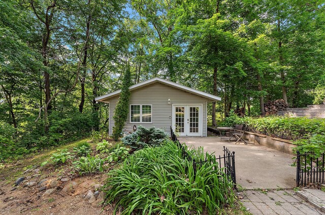 1202 Matteson St, Faribault, MN 55021 - rear view of house featuring french doors and a patio area