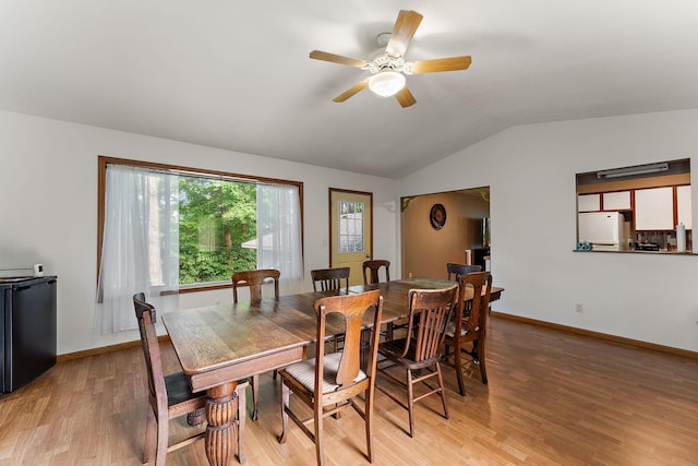 1202 Matteson St, Faribault, MN 55021 - dining area with vaulted ceiling, light wood-type flooring, and a ceiling fan