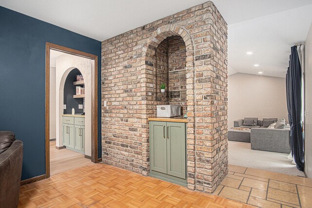 201 Elm St, Luverne, MN 56156 - corridor with brick wall and recessed lighting