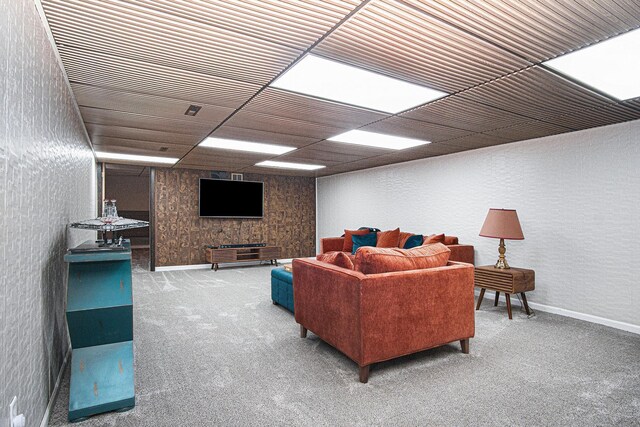 201 Elm St, Luverne, MN 56156 - carpeted living area with baseboards and a drop ceiling