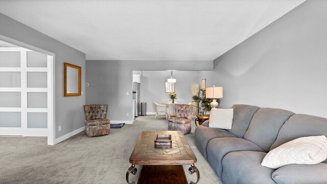 4397 Wilshire Blvd # E305, Mound, MN 55364 - carpeted living area featuring baseboards and radiator heating unit
