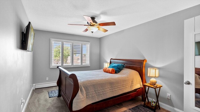 4397 Wilshire Blvd # E305, Mound, MN 55364 - carpeted bedroom with baseboard heating and ceiling fan