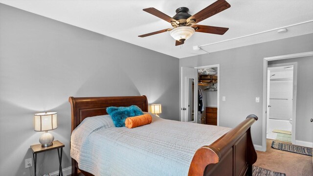 4397 Wilshire Blvd # E305, Mound, MN 55364 - bedroom featuring attic access, light carpet, a spacious closet, a ceiling fan, and a closet