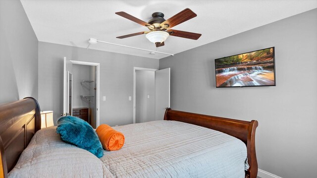 4397 Wilshire Blvd # E305, Mound, MN 55364 - bedroom with ceiling fan and a walk in closet