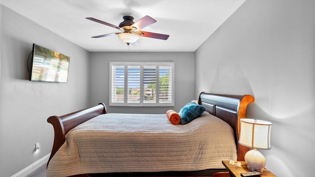 4397 Wilshire Blvd # E305, Mound, MN 55364 - bedroom with baseboards and a ceiling fan