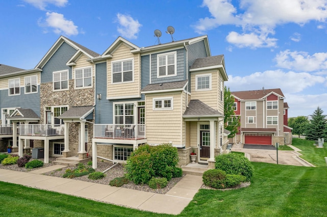 1842 Colonial Ln Unit 6, Chanhassen, MN 55317 - view of front of property with stone siding, a front yard, roof with shingles, and an attached garage