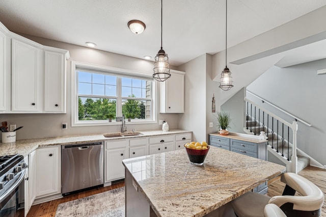 1842 Colonial Ln Unit 6, Chanhassen, MN 55317 - kitchen with stainless steel appliances, wood finished floors, white cabinets, and a kitchen breakfast bar
