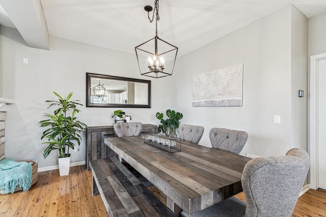 1842 Colonial Ln Unit 6, Chanhassen, MN 55317 - dining area featuring a chandelier and wood finished floors