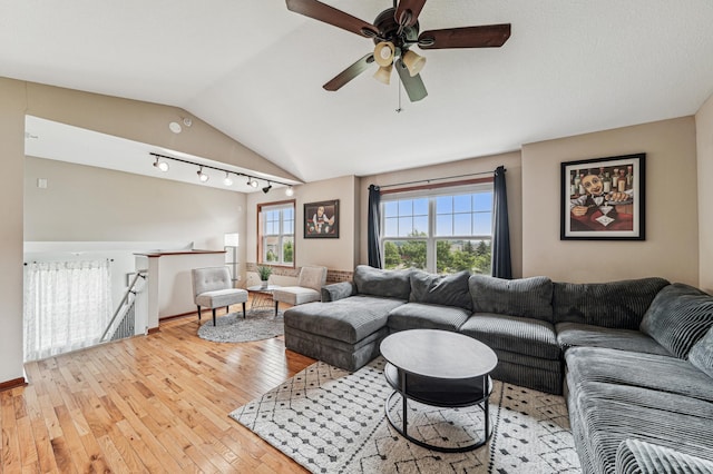 1842 Colonial Ln Unit 6, Chanhassen, MN 55317 - living area with light wood-type flooring, vaulted ceiling, and a ceiling fan