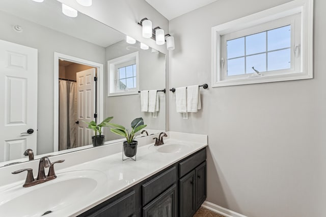 1842 Colonial Ln Unit 6, Chanhassen, MN 55317 - bathroom featuring double vanity and baseboards