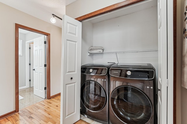 1842 Colonial Ln Unit 6, Chanhassen, MN 55317 - laundry area with washer and dryer and wood finished floors