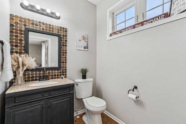 1842 Colonial Ln Unit 6, Chanhassen, MN 55317 - bathroom with backsplash, wood finished floors, and vanity
