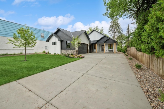 3909 54th St, Edina, MN 55424 - modern inspired farmhouse featuring board and batten siding, an attached garage, driveway, and stone siding