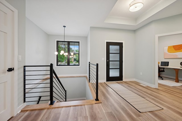 3909 54th St, Edina, MN 55424 - entryway with wood finished floors, a chandelier, and a raised ceiling
